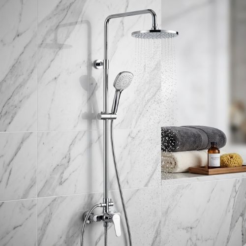 Modern Rainfall & Handheld Dual Shower Suite in polished chrome, mounted on a luxury white marble wall with active water flow and spa-inspired bathroom decor.