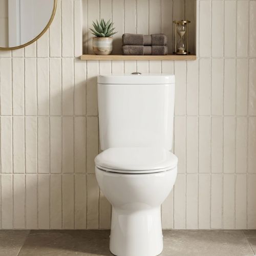 Modern white ceramic water closet set with a dual-flush system, featured in a high-end contemporary bathroom interior.