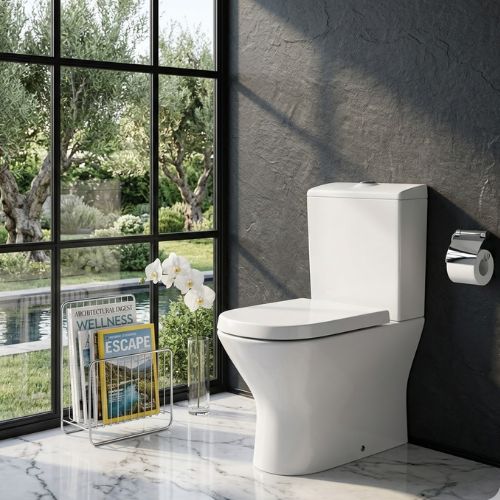 Sleek Nexo WC in white ceramic, featuring a modern soft-square design in a luxury bathroom with marble floors and garden views.