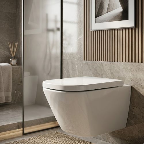 A premium wall-hung white square water closet by Neatflow Solution, elegantly mounted on a textured marble wall in a modern, sunlit luxury bathroom in Lagos.
