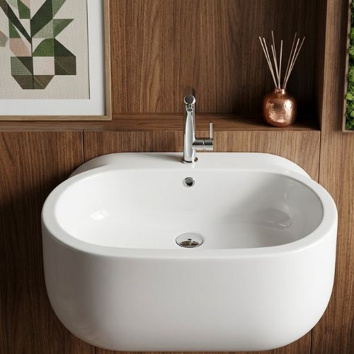 A premium 90 WCA wall-mounted washbasin by Neatflow Solution featuring a unique, seamless cocoon design in high-gloss white ceramic, paired with a modern polished chrome faucet.