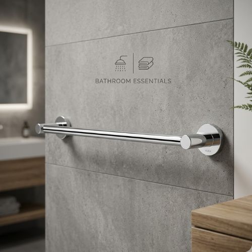 A sleek, chrome towel bar mounted on a grey stone wall in a modern, luxury bathroom.