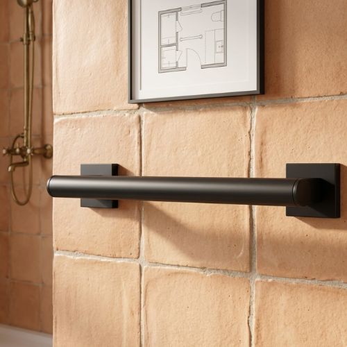 A professional, wall-mounted angular grab bar in polished chrome, featuring a distinct 135-degree ergonomic bend and sleek circular mounting flanges.