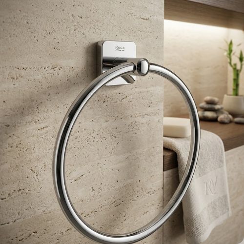 A premium Roca Victoria 200mm chrome towel ring mounted on a luxury stone wall, showcasing a minimalist and polished bathroom aesthetic.
