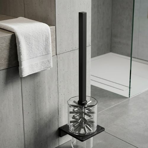 A premium matte black S-CUBE WC brush set featuring a modern square-style holder and stainless steel handle, displayed in a high-end luxury bathroom setting.
