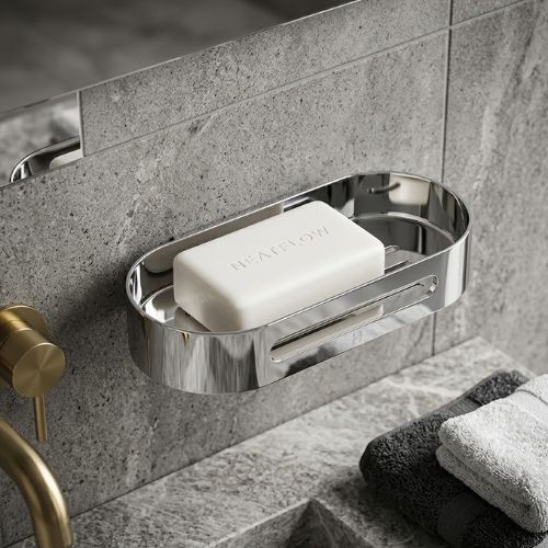 A designer SS 21 shower basket in mirror-polished 304 stainless steel, featuring a sleek slotted drainage design for a luxury modern bathroom aesthetic.