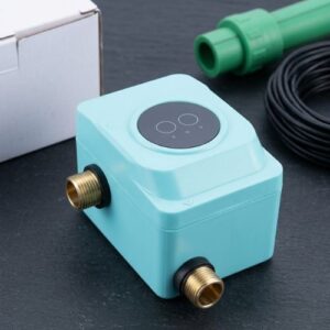 An eye-level shot of a modern, compact, automatic AC/DC water booster pump in a sleek cyan casing, professionally installed inline with durable green PPR water pipes against a clean background.
