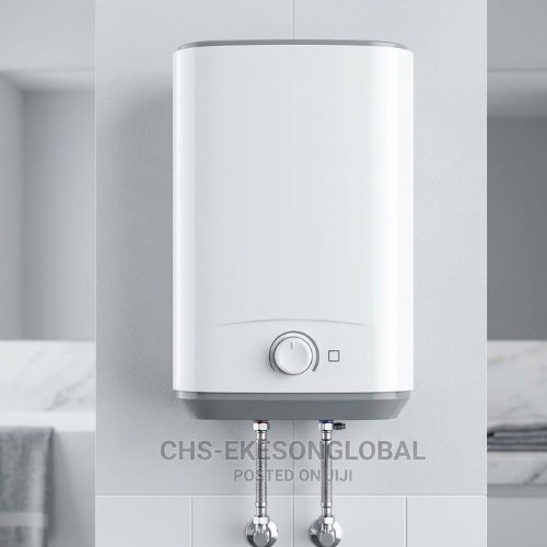 A white wall-mounted Ariston electric water heater with chrome plumbing fittings, installed against a clean, modern bathroom wall.