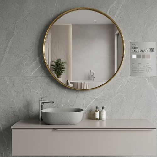 A modern, minimalist wall-mounted bathroom vanity featuring a stone vessel sink, a large circular mirror, and a sophisticated gray textured wall background.