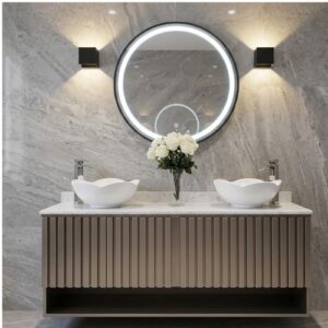 A luxurious floating bathroom double vanity featuring fluted brown cabinetry, two unique wavy-edged vessel sinks, a central bouquet of white roses, and a large, round LED-backlit mirror flanked by modern black sconces against a grey marble wall.